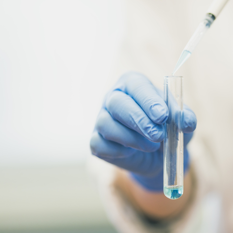 Scientist pipetting